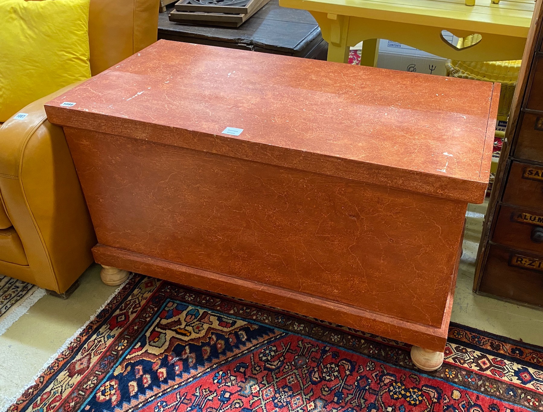 A Victorian style russet painted pine trunk, length 104cm, depth 51cm, height 59cm